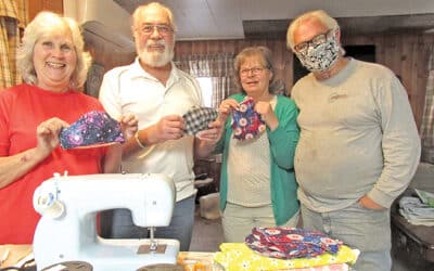 Lioness members sewing masks to save lives