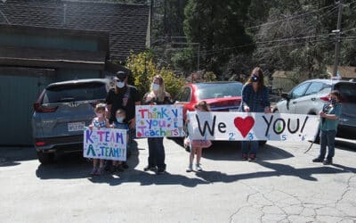 Well-wishers line streets to greet teachers’ car parade