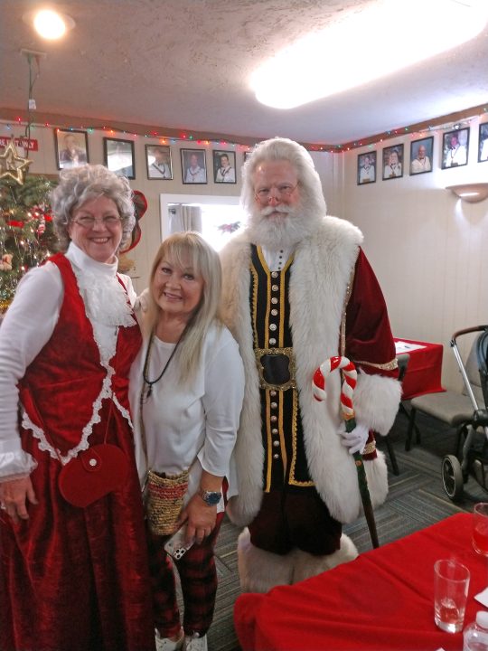 Adrianne, Lisa, Julia, Melissa and Adrianna from Glendora and Orange County enjoyed last year’s Brewfest at Tavern Bay Beach Club so much they couldn’t resist attending this year’s event. (Photos by Douglas W. Motley) Smiling trio with Christmas costumes indoors.