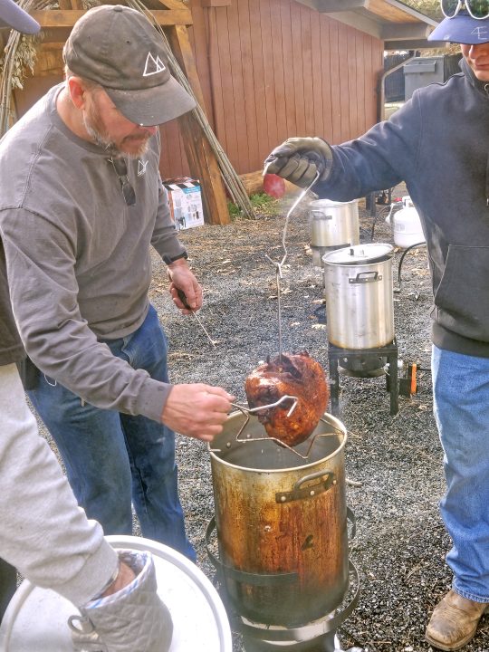 A team of volunteers deep-fried about half of the 89 turkeys. (Photo by Jack Cooperman)