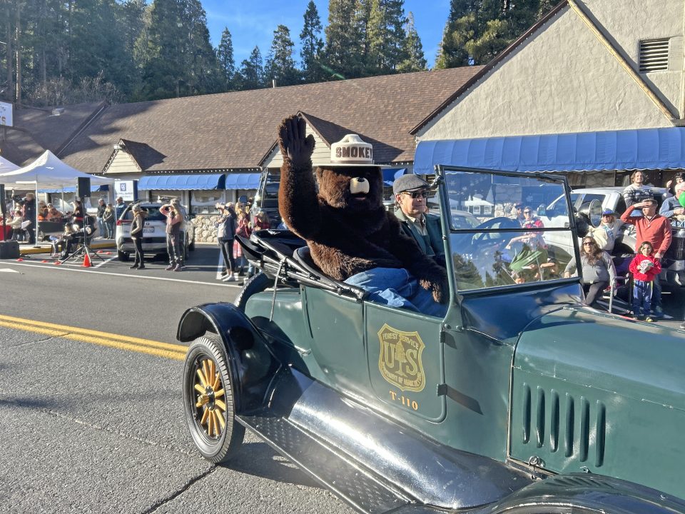 Adrianne, Lisa, Julia, Melissa and Adrianna from Glendora and Orange County enjoyed last year’s Brewfest at Tavern Bay Beach Club so much they couldn’t resist attending this year’s event. (Photos by Douglas W. Motley) Smokey Bear waves from vintage car in parade.