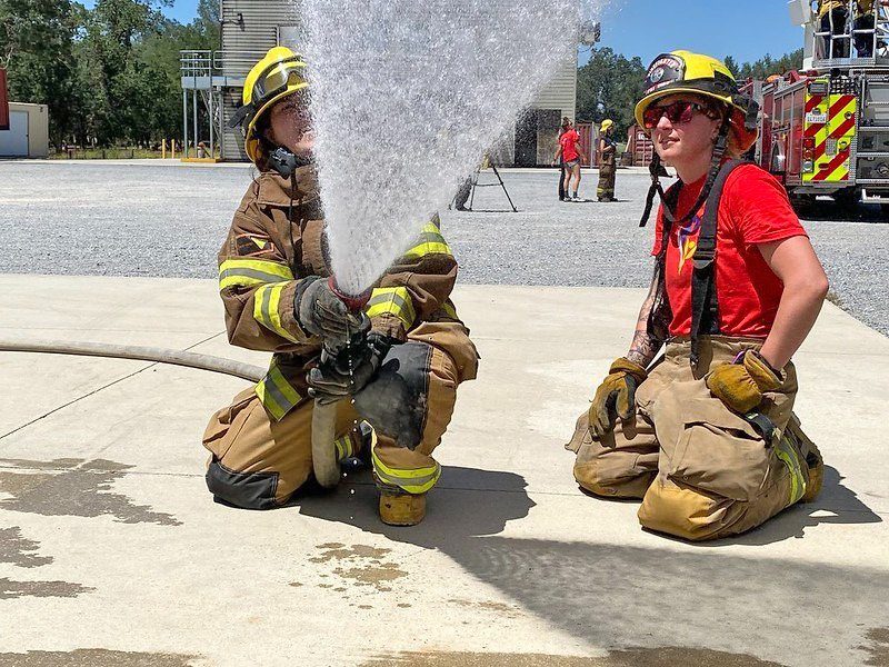 Hose handling is one of the skills taught at Camp Cinder. (Photos: Cal Fire)