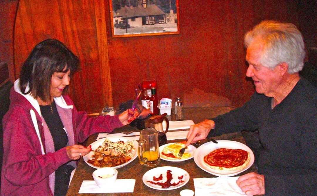Roger Rosegrant and Mary Pane may well be the restaurant’s longest-term patrons. The Encino couple has been dining at Cedar Glen Inn since it opened 32 years ago and on this site for more than 50 years. (Photo by T. Wilcox)