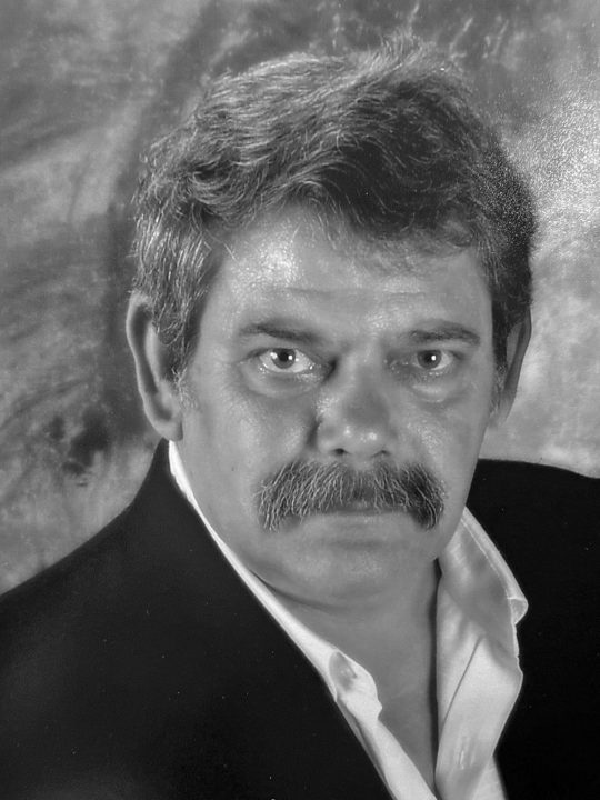 Portrait of a man with a mustache in suit