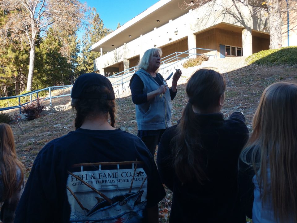 Before the girls started planting daffodil bulbs, Cathy Kay explained the proper method to them.