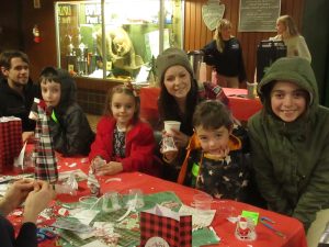 Mom and Dad watch as these Crestline kids have fun at the arts and crafts table.