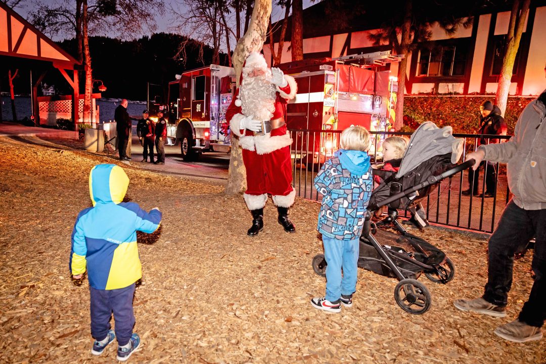 Adrianne, Lisa, Julia, Melissa and Adrianna from Glendora and Orange County enjoyed last year’s Brewfest at Tavern Bay Beach Club so much they couldn’t resist attending this year’s event. (Photos by Douglas W. Motley) Santa greets children near fire truck at night festival.