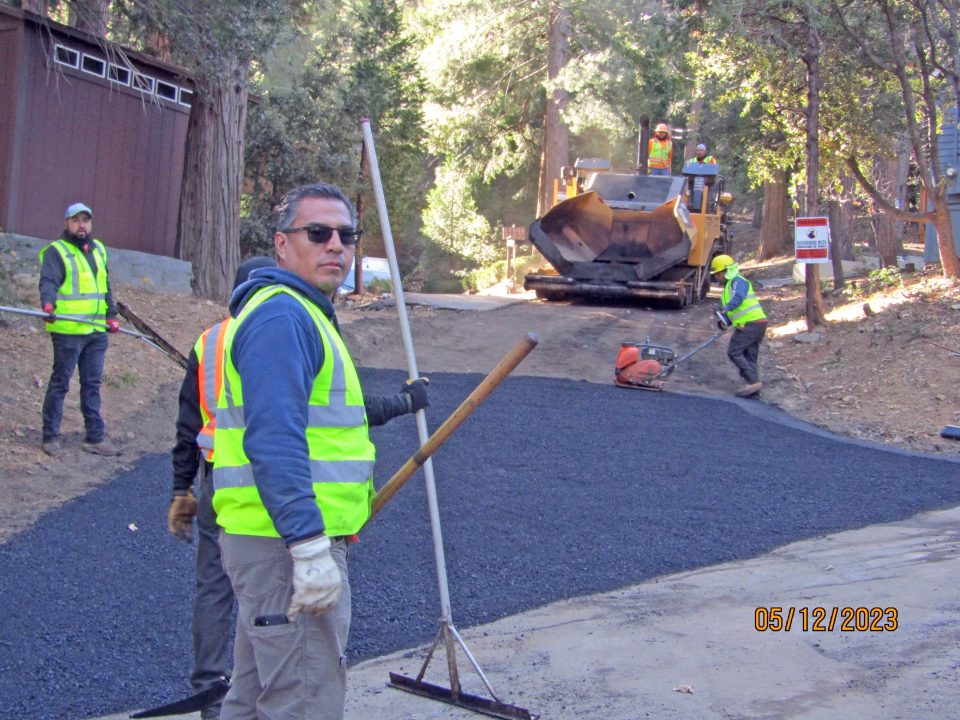Adrianne, Lisa, Julia, Melissa and Adrianna from Glendora and Orange County enjoyed last year’s Brewfest at Tavern Bay Beach Club so much they couldn’t resist attending this year’s event. (Photos by Douglas W. Motley) Workers paving asphalt road in forest area.