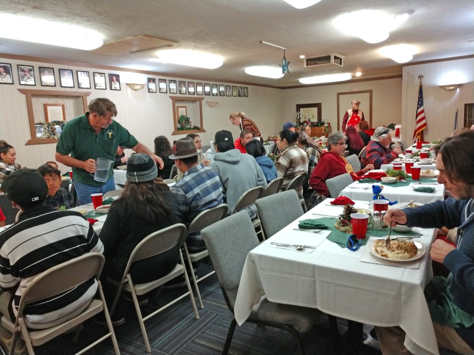 The dining room at the Elks Lodge was abuzz with conversation as volunteers served Christmas Day dinner.