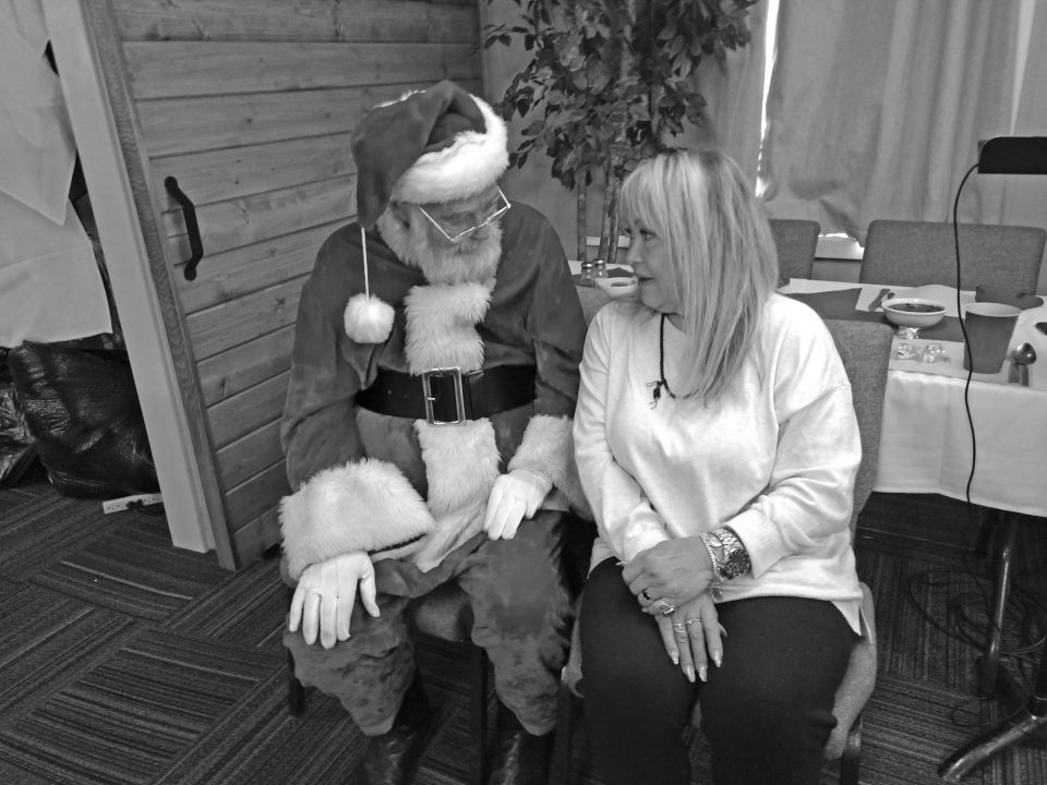 Holland Lowe, executive director of Operation Provider, was deep in conversation with Santa.