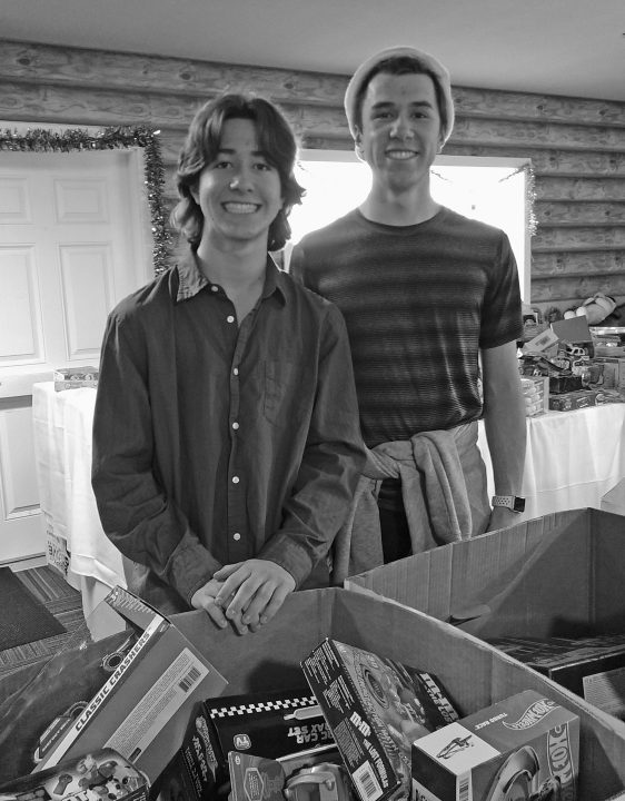 Chris and Ryan Whitty worked tirelessly all day, choosing toys for the lucky children who came to the free community dinner on Christmas Day.