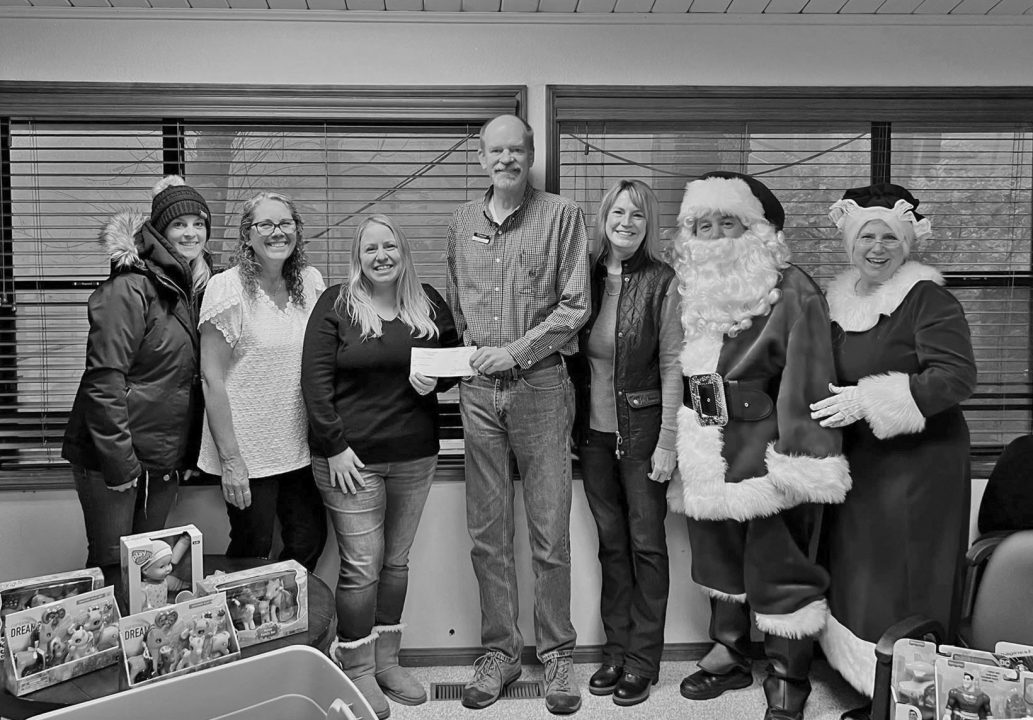 Adrianne, Lisa, Julia, Melissa and Adrianna from Glendora and Orange County enjoyed last year’s Brewfest at Tavern Bay Beach Club so much they couldn’t resist attending this year’s event. (Photos by Douglas W. Motley) Group photo with Santa and holiday gifts.