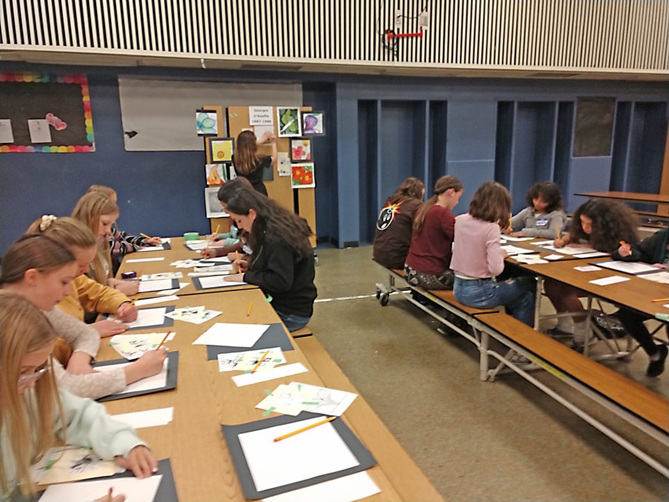 The girls were hard at work, drawing their flowers, then coloring them in with watercolor crayons.