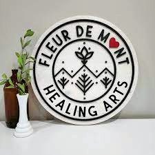 Fleur de Mont Healing Arts logo on display