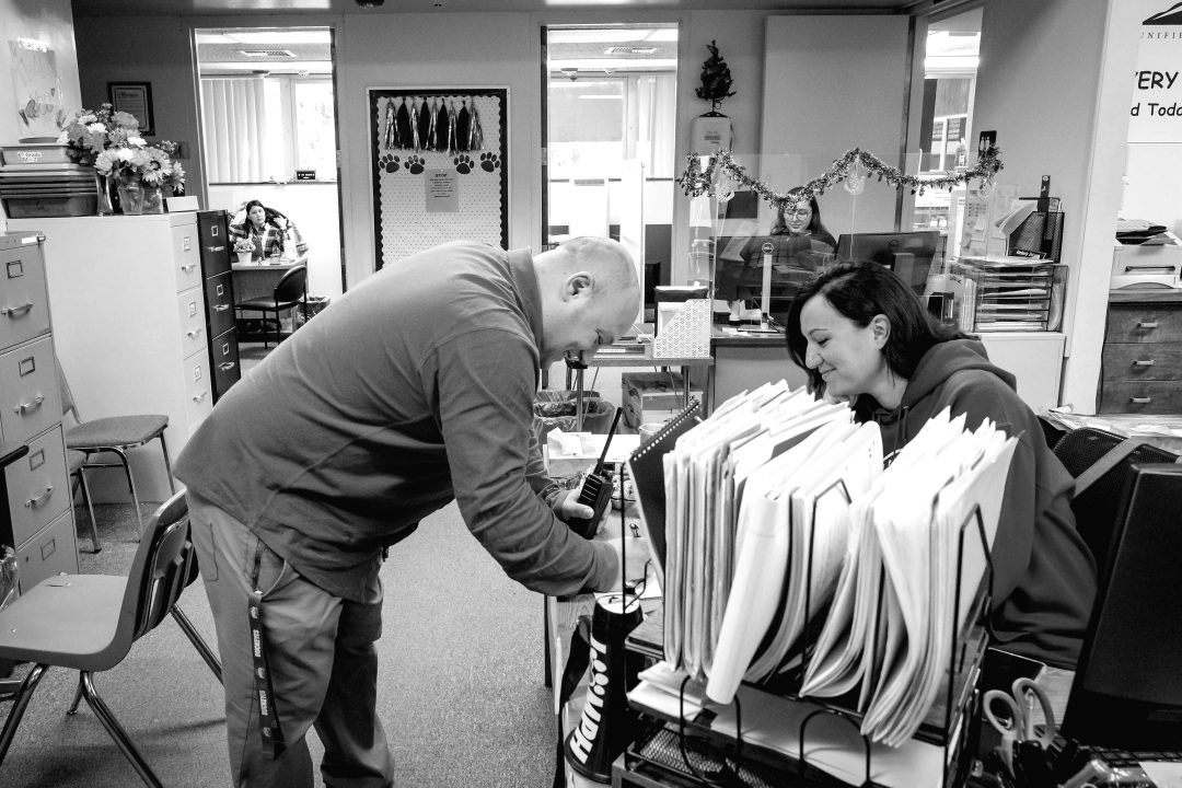Principal Terry Gomes works with the MPH office staff.
