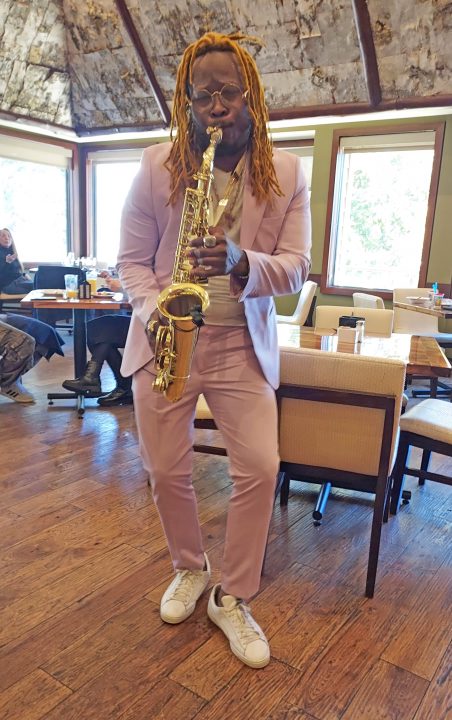 Adrianne, Lisa, Julia, Melissa and Adrianna from Glendora and Orange County enjoyed last year’s Brewfest at Tavern Bay Beach Club so much they couldn’t resist attending this year’s event. (Photos by Douglas W. Motley) Musician playing saxophone in restaurant, pink suit.