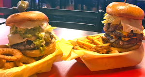 In a strikingly literal sense, Malt Shop hamburgers are a tall order. (Photo courtesy of Cedar Glen Malt Shop)