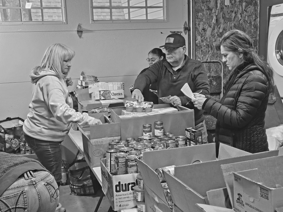 Adrianne, Lisa, Julia, Melissa and Adrianna from Glendora and Orange County enjoyed last year’s Brewfest at Tavern Bay Beach Club so much they couldn’t resist attending this year’s event. (Photos by Douglas W. Motley) Volunteers sorting donations at food bank.