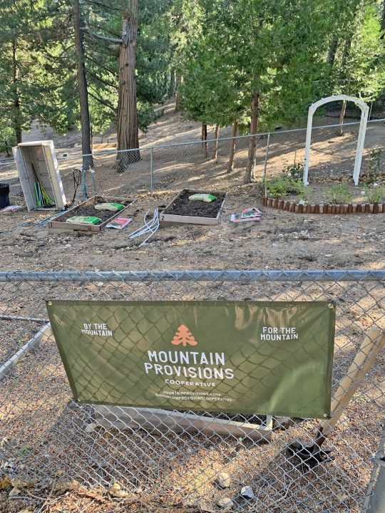 Adrianne, Lisa, Julia, Melissa and Adrianna from Glendora and Orange County enjoyed last year’s Brewfest at Tavern Bay Beach Club so much they couldn’t resist attending this year’s event. (Photos by Douglas W. Motley) Community garden with Mountain Provisions sign.
