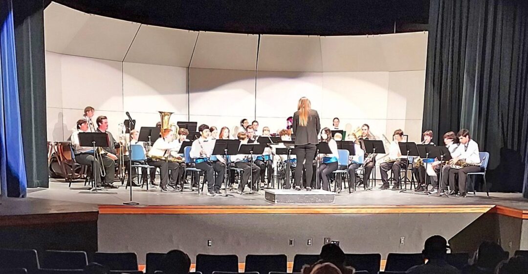 Adrianne, Lisa, Julia, Melissa and Adrianna from Glendora and Orange County enjoyed last year’s Brewfest at Tavern Bay Beach Club so much they couldn’t resist attending this year’s event. (Photos by Douglas W. Motley) School band performing on stage with conductor.