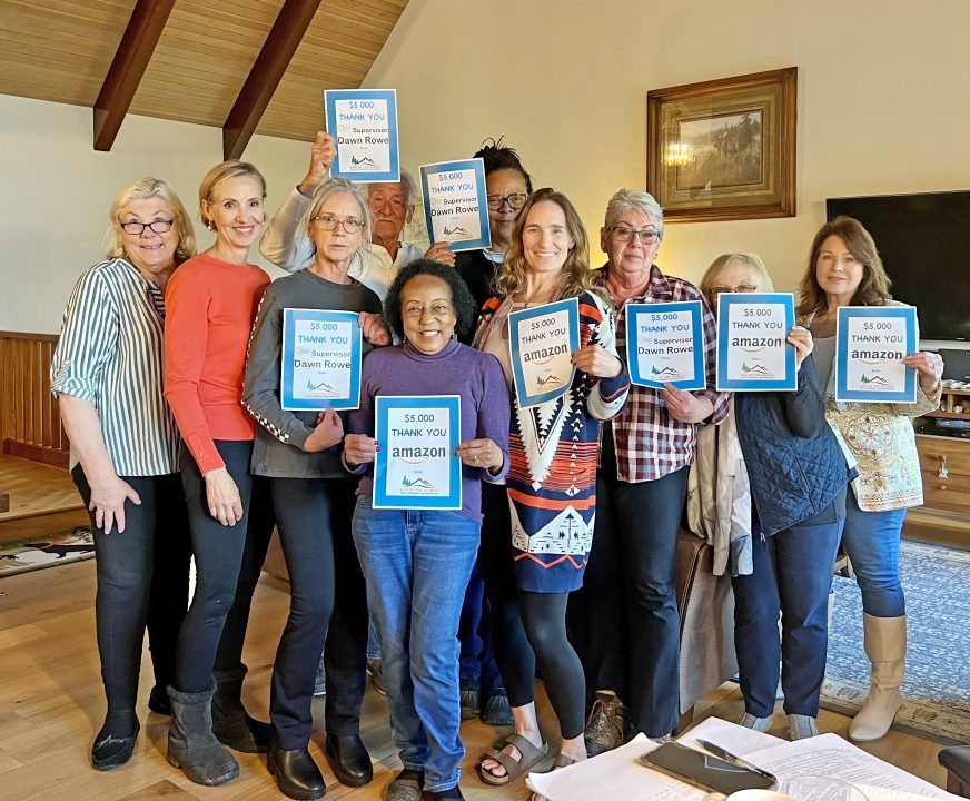 Adrianne, Lisa, Julia, Melissa and Adrianna from Glendora and Orange County enjoyed last year’s Brewfest at Tavern Bay Beach Club so much they couldn’t resist attending this year’s event. (Photos by Douglas W. Motley) Group holding thank you signs indoors.
