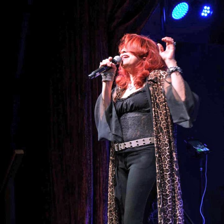 Adrianne, Lisa, Julia, Melissa and Adrianna from Glendora and Orange County enjoyed last year’s Brewfest at Tavern Bay Beach Club so much they couldn’t resist attending this year’s event. (Photos by Douglas W. Motley) Singer performing on stage with red hair.