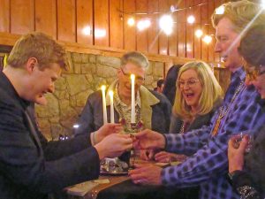 Magician Zac Swan (L) fascinated crowds with his creative card tricks and illusions.