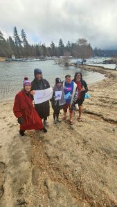 Because there was a Rim Special Olympics event on Feb. 3, these jumpers – Kim Mears, Madison Mears, Polly Sauer, Michael Gladwell and Bob Gladwell – jumped into Tavern Bay on Feb. 4 to benefit Special Olympics, Mountain Jewish Community and the Women’s Club of Lake Arrowhead. (Photo by Allison Banner)