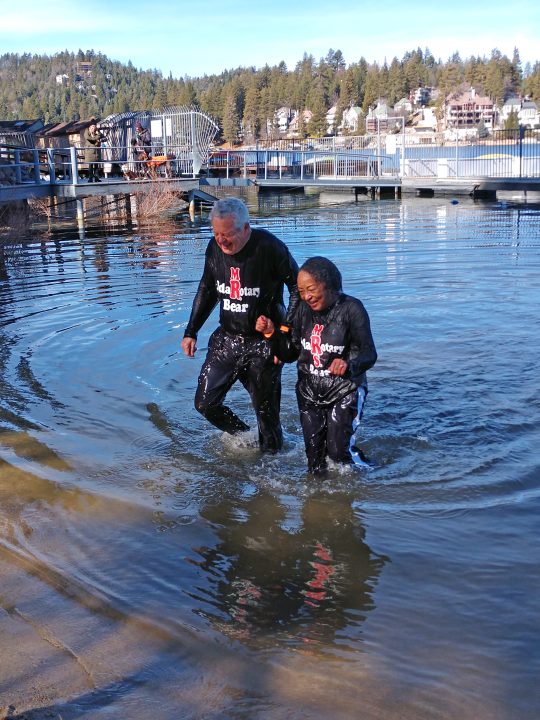 The king and queen of the Plunge – Patrick and Jo Bonita Rains – emerge from the chilly waters of the lake. (Photos by Mary-Justine Lanyon)