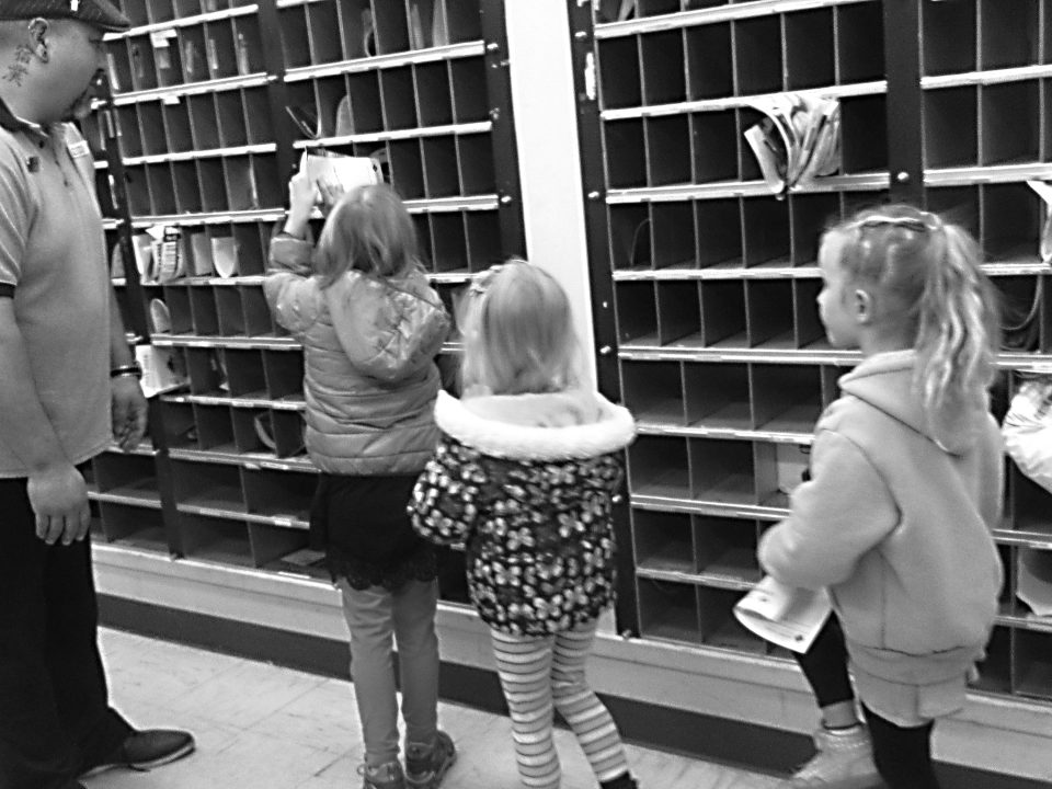 Adrianne, Lisa, Julia, Melissa and Adrianna from Glendora and Orange County enjoyed last year’s Brewfest at Tavern Bay Beach Club so much they couldn’t resist attending this year’s event. (Photos by Douglas W. Motley) Children exploring post office mail slots with adult.