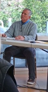 General Manager Mike Pate listens as Roberta Rindenow addressed the issue of wakes on the lake.