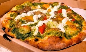 A vegetarian delight, Deer Meadow is an artisan pizza topped with roasted red peppers, caramelized onions, mozzarella and ricotta cheese. (Food photos courtesy of LouEddie’s Pizza)
