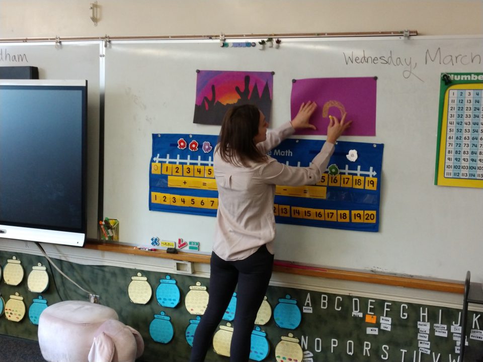 Lindsey Villarreal demonstrates how the students should create their rainbows.