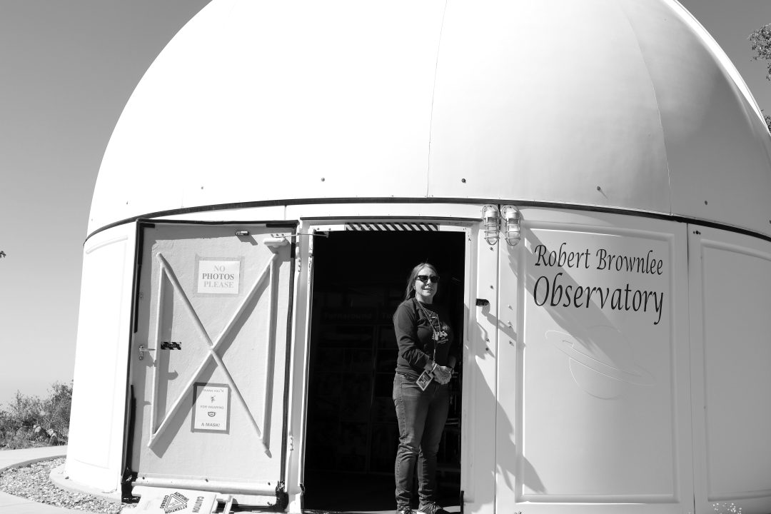 Person at entrance of Robert Brownlee Observatory.