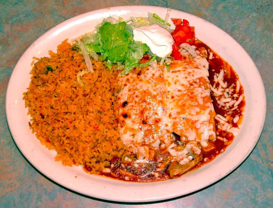 Two chicken or beef enchiladas with rice, beans, tomato and sour cream are among an enticing lineup of daily specials. (Photo by T. Wilcox) 