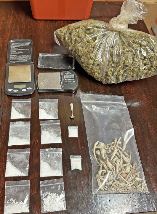 Scales and various substances on a table.