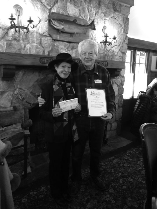 Dr. Patrick Rains presented Polly Sauer with a check for $550 from the pledges for Sauer’s jump into Lake Arrowhead as part of the PolaRotary Bear Plunge.