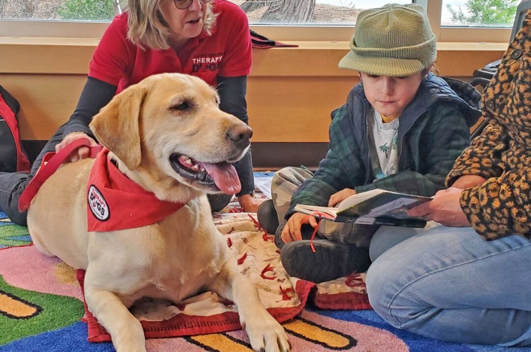 Adrianne, Lisa, Julia, Melissa and Adrianna from Glendora and Orange County enjoyed last year’s Brewfest at Tavern Bay Beach Club so much they couldn’t resist attending this year’s event. (Photos by Douglas W. Motley) Therapy dog with child reading book in library.