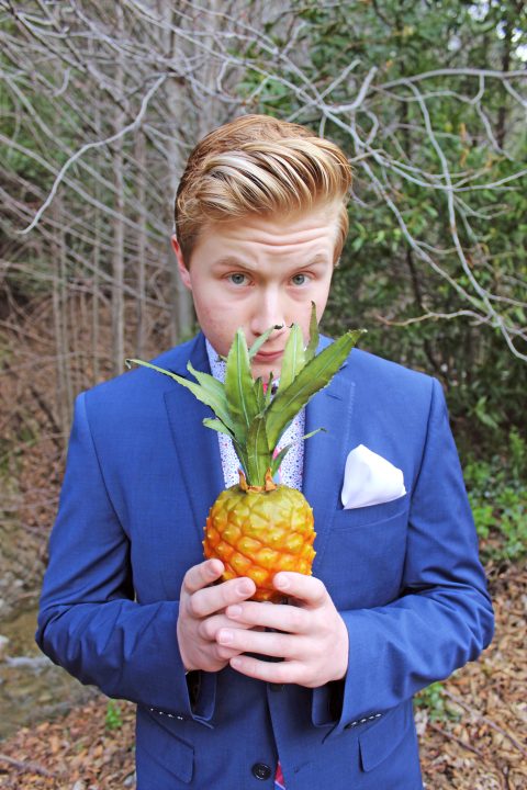 Adrianne, Lisa, Julia, Melissa and Adrianna from Glendora and Orange County enjoyed last year’s Brewfest at Tavern Bay Beach Club so much they couldn’t resist attending this year’s event. (Photos by Douglas W. Motley) Person holding pineapple in forest, wearing blue suit.