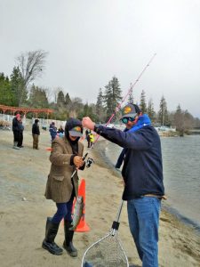 Jessie Bolognino with his Dad, Jason, and a rainbow trout.