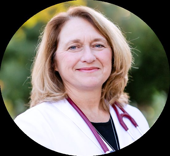 Smiling doctor with stethoscope outdoors