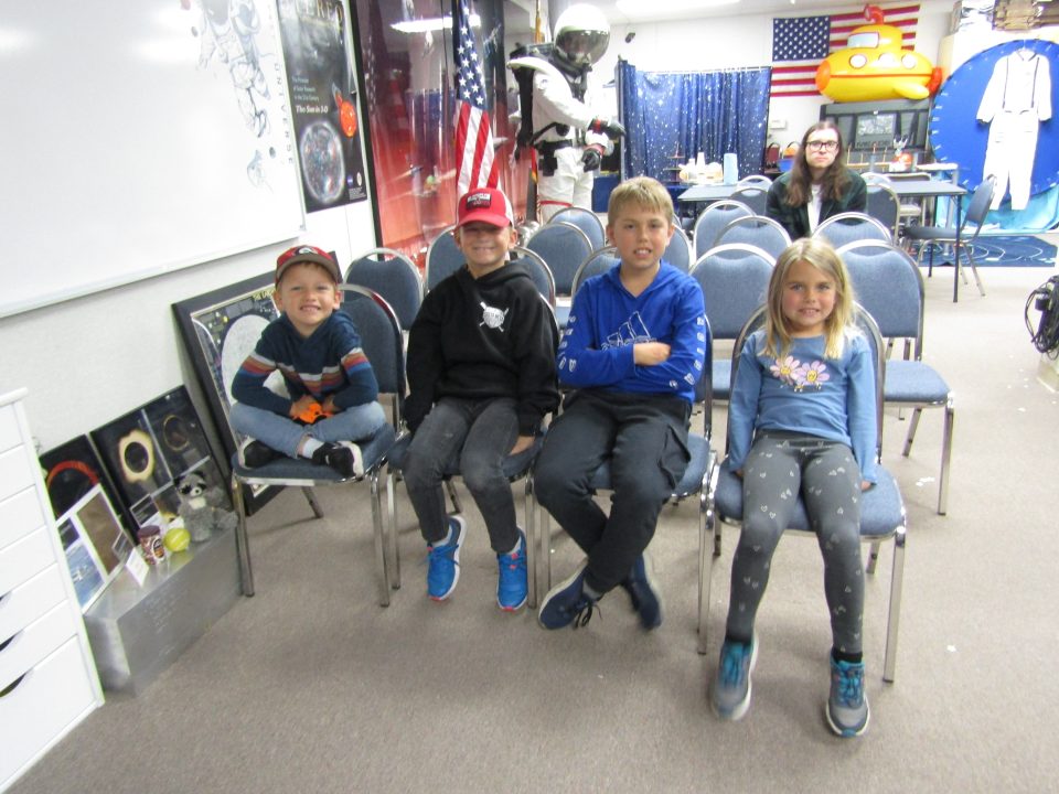Nine-year-old Reiner from Costa Mesa (second from right) said he was amazed that poop could be fossilized.