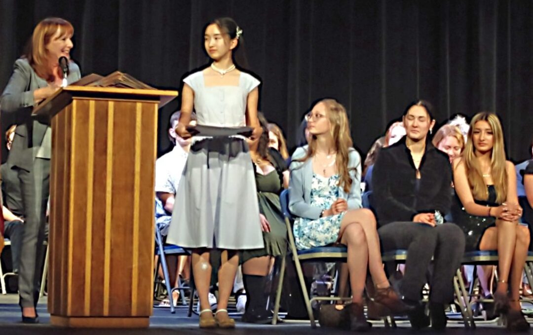Diane Zhang received the first award of the night from Cindy Gardner, representing the Rim of the World Communities Scholarship Council.