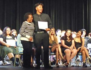 Osvaldo Perez received the AVID scholarship from Rim of the World Education Foundation president Jo Bonita Rains.