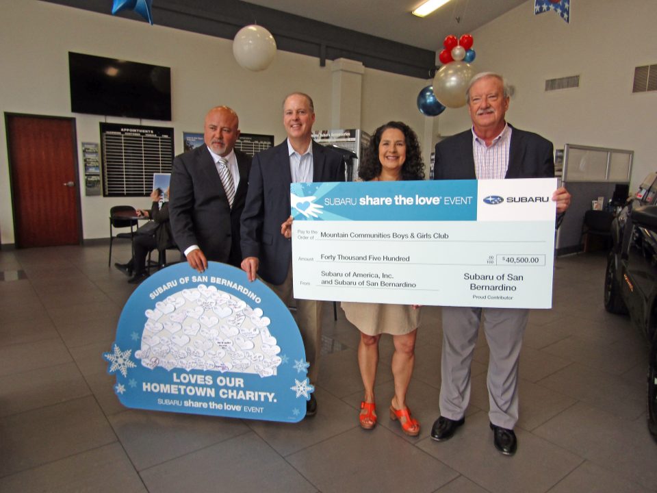 Adrianne, Lisa, Julia, Melissa and Adrianna from Glendora and Orange County enjoyed last year’s Brewfest at Tavern Bay Beach Club so much they couldn’t resist attending this year’s event. (Photos by Douglas W. Motley) Group holding donation check at Subaru event.
