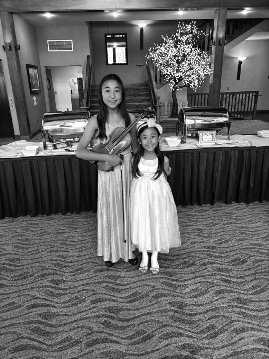 Erin and Sara Zhou charmed the Auxiliary members with their music at the brunch.