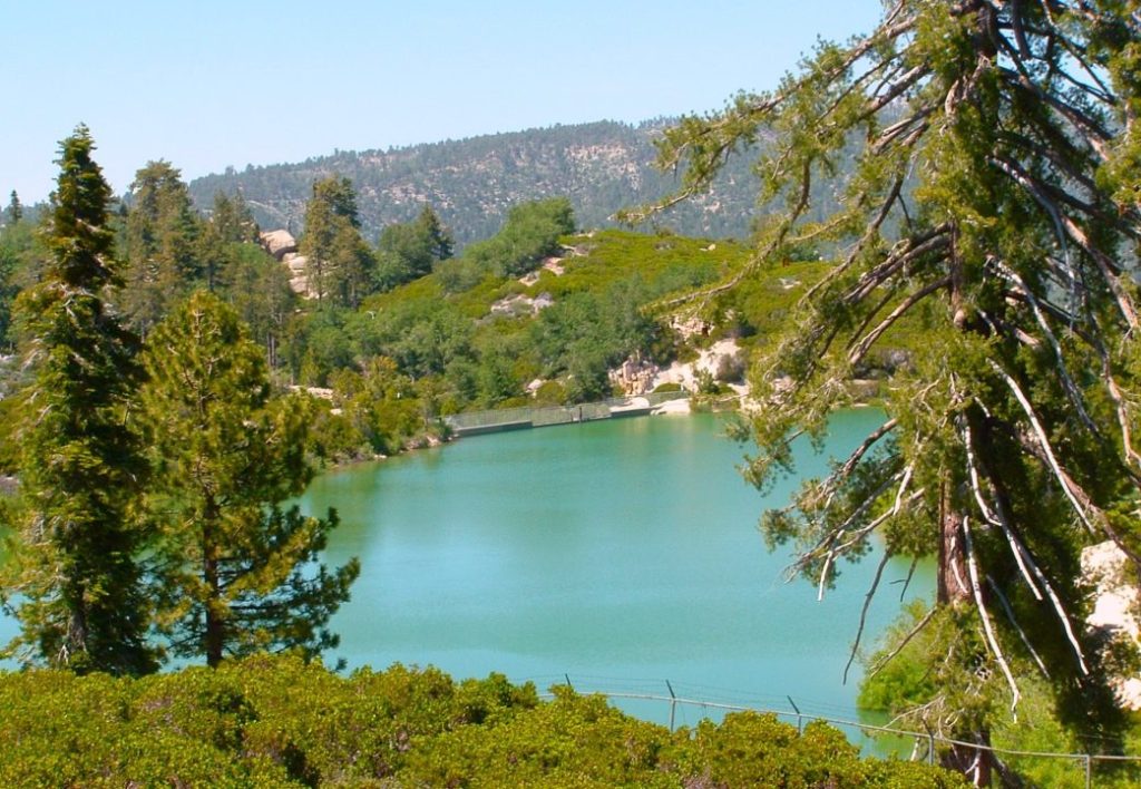 From the trail’s one-mile point, Snow Valley Lake is just steps away. This reservoir supplies water for making snow during the ski season.