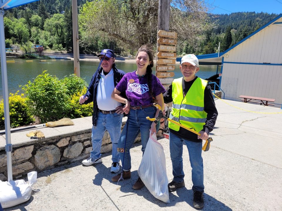 Adrianne, Lisa, Julia, Melissa and Adrianna from Glendora and Orange County enjoyed last year’s Brewfest at Tavern Bay Beach Club so much they couldn’t resist attending this year’s event. (Photos by Douglas W. Motley) Volunteers cleaning up near a lake.