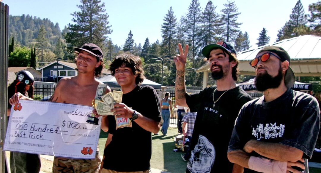 Best Trick winner Jordan Karasch being presented his $100 check by Stoops owners Josh Thrower and Tyler Aubrey with DJ Nodnoise, who was announcing the presentation.