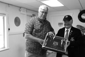 Steve Henze from Lake Gregory Yacht Club receives his first-place award from Commodore Rick Dinon.